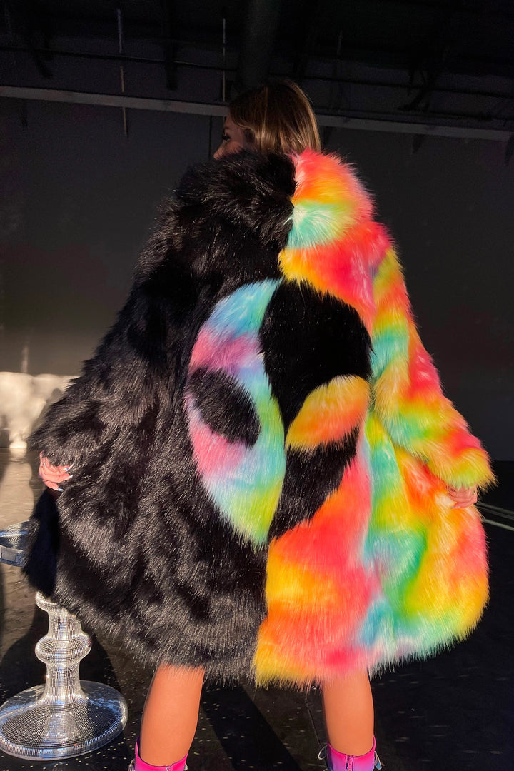 Area 51 alt text: Area 51 Alien face coat black and neon rainbow faux fur by Space island. Spvce Island is a wearable art collective featuring festival fashion, rave wear, club wear and streetwear. Buy coats, jackets, platform boots, gogo boots, rainbow platform sneakers, holographic sandals, shoes, burning man goggles, crystal chokers, holographic corsets, joggers, rave bottoms, bikinis, harnesses, bondage and more.