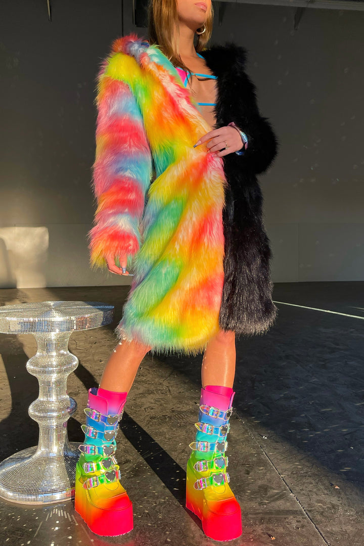 Area 51 alt text: Area 51 Alien face coat black and neon rainbow faux fur by Space island. Spvce Island is a wearable art collective featuring festival fashion, rave wear, club wear and streetwear. Buy coats, jackets, platform boots, gogo boots, rainbow platform sneakers, holographic sandals, shoes, burning man goggles, crystal chokers, holographic corsets, joggers, rave bottoms, bikinis, harnesses, bondage and more.